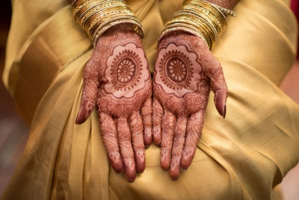 Female hands showing henna tattoos